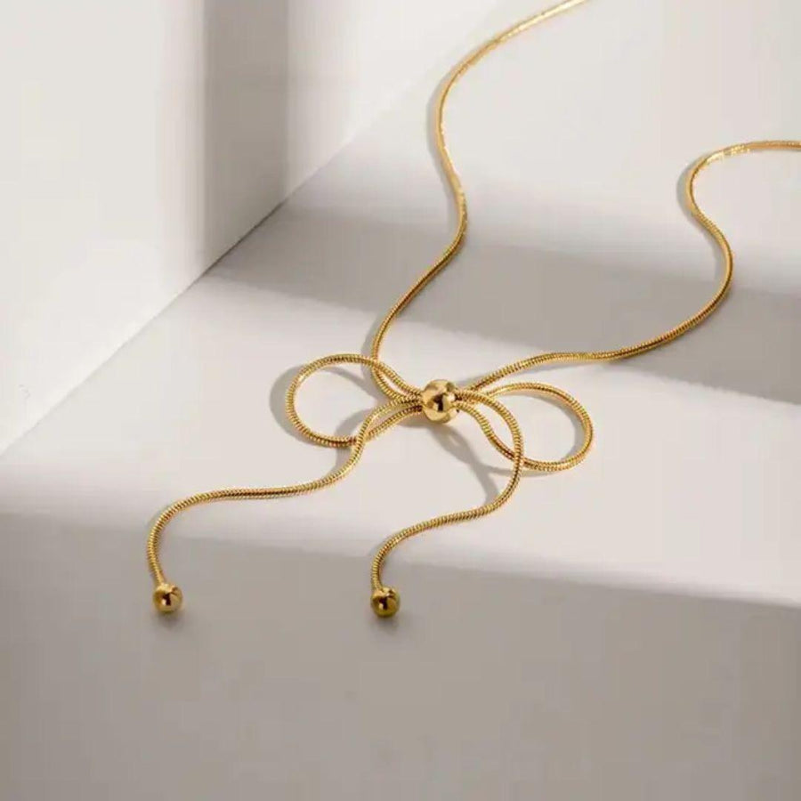 At The 11th Hour  bow Neckpiece